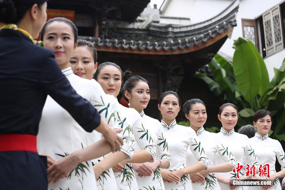 Girls practice smile with chopsticks