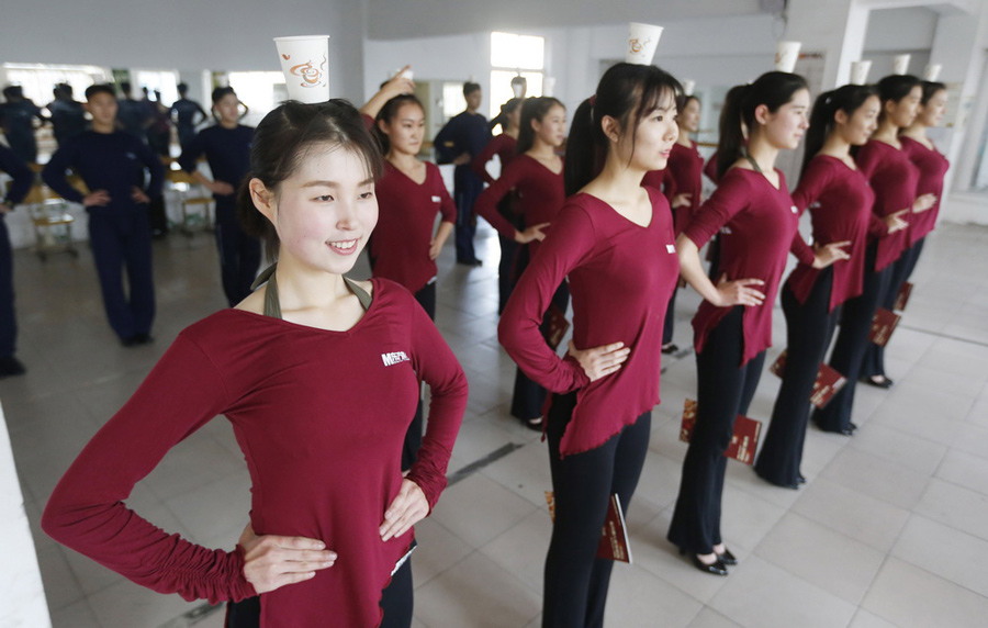 Retired female soldier trains hard to be flight attendant