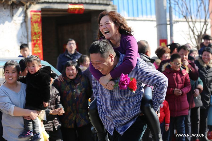 Wife-carrying contest held during celebrations in C China