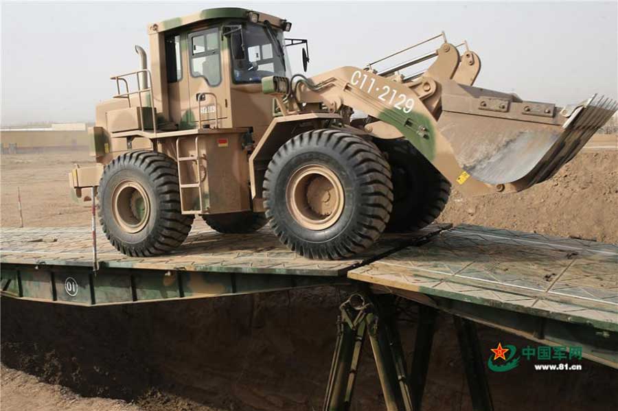 Engineer troop builds bridge in real combat conditions