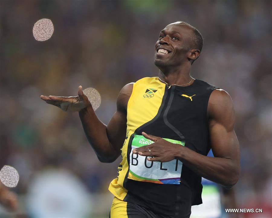 Bolt wins third Olympic men's 100m title