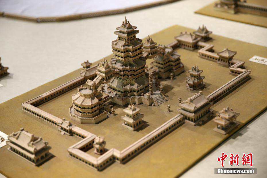 Elderly man carves miniature landscape of Daming Palace with bricks