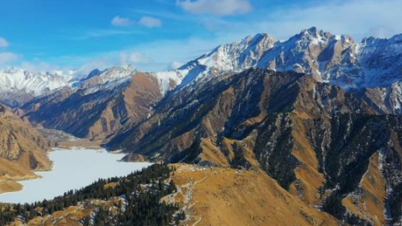 Scenery of Duku highway in snow-covered mountain in Xinjiang