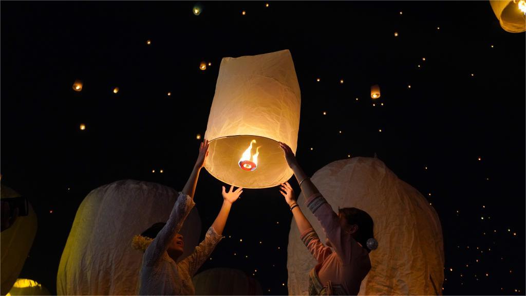 People fly Kongming lanterns to celebrate New Year of calendar of Dai ethnic group