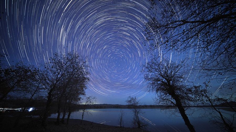 Brilliant starry sky over Luobu Lake in NW China's Xinjiang