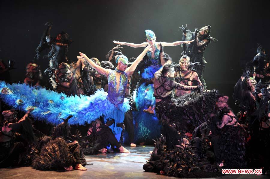 Chinese dancing master Yang Liping's dance drama "The Peacock" is staged in Qingdao, a coastal city in east China's Shandong Province, Nov. 7, 2012. Yang started her six-month performing tour of "The Peacock" last August in Kunming, capital of southwest China's Yunnan Province. She will end her dancing career after the tour in 25 cities in China. (Xinhua/Li Ziheng) 