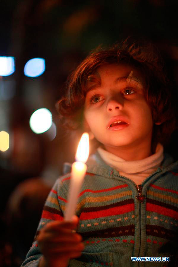 A Palestinian child takes part in a rally against Israeli military operation in the Gaza Strip, in the West Bank city of Ramallah, on Nov. 19, 2012. (Xinhua/Fadi Arouri)