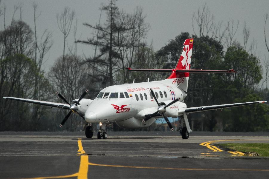 An air ambulance transporting four Chinese workers of an oil company is seen upon landing at the airport in Bogota, Colombia, on Nov. 22, 2012. Four Chinese hostages who were kidnapped in Colombia by the Revolutionary Armed Forces of Colombia (FARC) guerrilla group last year have been released, the Chinese embassy in Colombia confirmed Thursday. (Xinhua/Jhon Paz) 