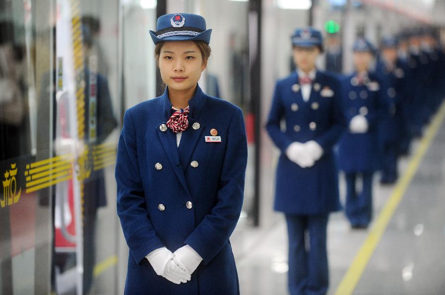 Crew members from Hangzhou Subway Line 1 are seen in Hangzhou, capital of east China's Zhejiang Province, Nov. 24, 2012. Hangzhou Subway Line 1, the first subway in Zhejiang covering a distance of 47.97 kilometers, was put into a trial operation on Saturday after five years of construction. (Xinhua/Huang Zongzhi) 