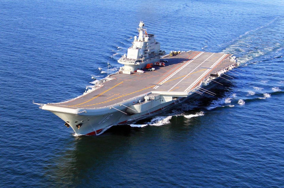 China's first aircraft carrier, the Liaoning, sails on the sea. China has conducted flight landing on its first aircraft carrier.(Xinhua/Cha Chunming)