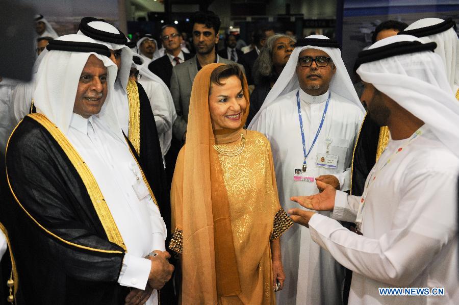 Abdullah bin Hamad Al-Attiyah (L), president of the 18th Conference of the Parties (COP18) to the United Nations Framework Convention on Climate Change (UNFCCC), and UNFCCC Executive Secretary Christiana Figueres (C) inspect the Qatar Sustainability Expo after its opening at the Doha Exhibition Center (DEC) in Doha, Nov. 26, 2012. Qatar Sustainability Expo, a demonstration of various environmentally-friendly technology projects from Qatar and abroad, opened at the DEC on Monday. (Xinhua/Li Muzi) 