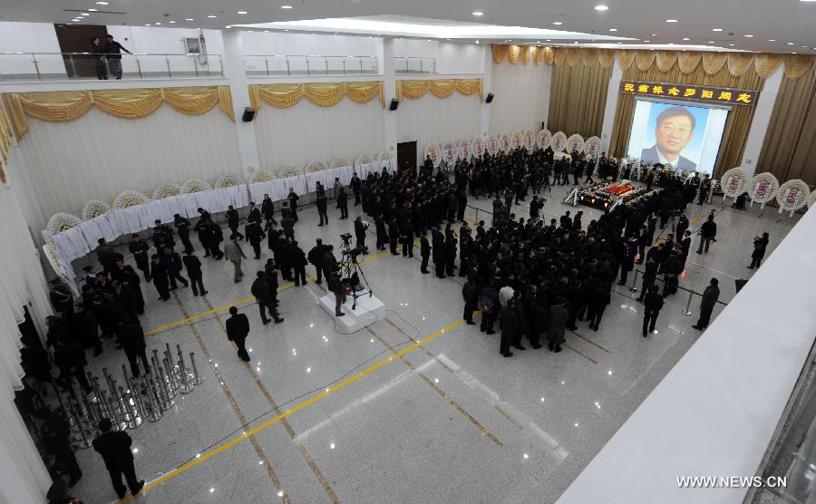 People attend a memorial service for Luo Yang, head of the production phase for China's new J-15 fighter jet, who died of a heart attack on Nov. 25, in the Huilonggang Cemetery for Revolutionaries in Shenyang, capital of northeast China's Liaoning Province, Nov. 29, 2012. Luo experienced a heart attack after observing aircraft carrier flight landing tests for China's first aircraft carrier, the Liaoning, on Nov. 25. He later died in hospital at the age of 51. He was also chairman and general manager of Shenyang Aircraft Corp. (SAC), a subsidiary of China's state-owned aircraft maker, Aviation Industry Corp. of China (AVIC). (Xinhua/Yang Qing) 