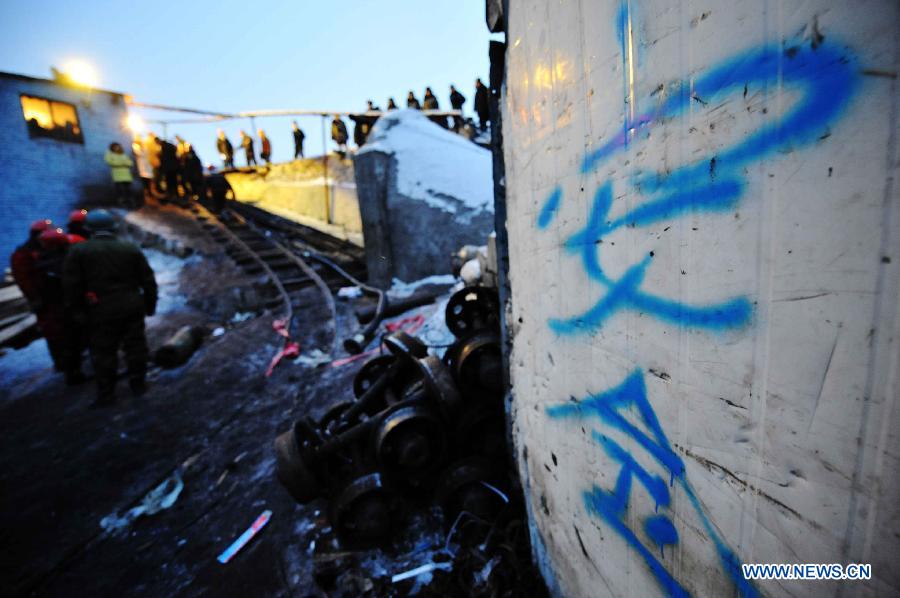 Photo taken on Dec. 2, 2012 shows the entrance of the flooded mine in Qitaihe City, northeast China's Heilongjiang Province. Rescuers on Sunday pulled two miners out alive while 14 others remain trapped after the Furuixiang Coal Mine in Qitaihe City was flooded on Saturday, according to local government sources. (Xinhua/Wang Jianwei) 