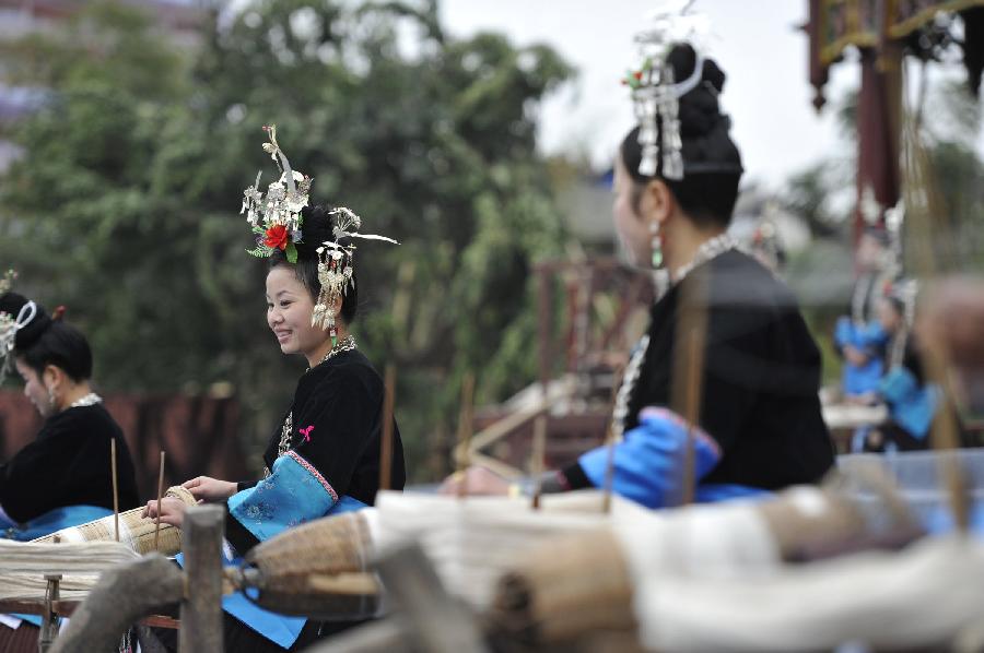 Women from Dong ethnic group perform in the opening ceremony of the Sama Festival in Rongjiang County, southwest China's Guizhou Province, Dec. 18, 2012. The Sama Festival, an ancient traditional festival commemorating the woman ancestors of Dong ethnic group, was listed as one of China's state intangible cultural heritages in 2006. The festival of this year will last till Dec. 20. (Xinhua/Ou Dongqu) 