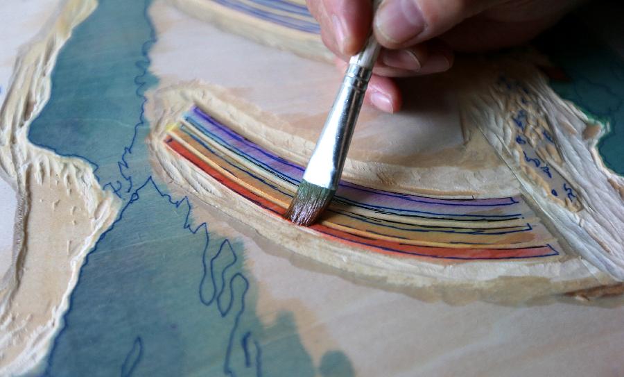 Chinese painter Lu Fang creates a woodblock painting at his studio in Hangzhou City, capital of east China's Zhejiang Province, Dec. 4, 2012. Lu Fang started to create woodblock paintings since 1950s, his works tend to depict the scenery of the West Lake in Hangzhou. The technique of woodblock printing was listed as a state intangbile cultural heritage of China in 2008. (Xinhua/Zhang Chuanqi) 