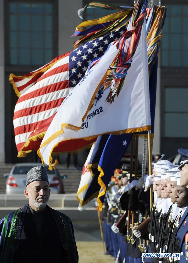 Visiting Afghan President Hamid Karzai inspects the honor guards during a welcome ceremony before meeting U.S. Defense Secretary Leon Panetta at the Pentagon outside Washington D.C., the United States, Jan. 10, 2013. (Xinhua/Zhang Jun) 