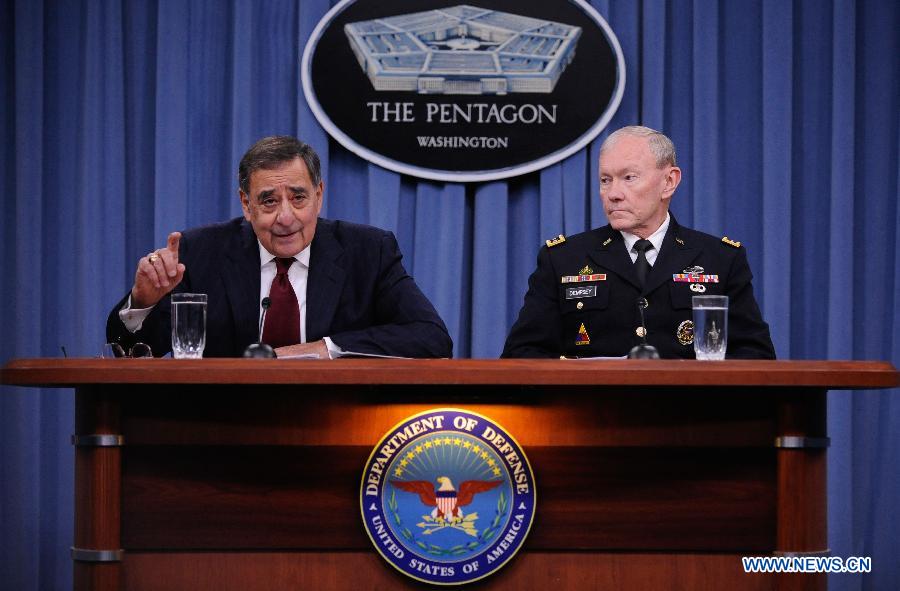 U.S. Defense Secretary Leon Panetta (L) attends a press conference with the U.S. chairman of joint chiefs of staff Martin Dempsey, at the Pentagon in Washington D.C., capital of the United States, Jan. 10, 2013. Panetta on Thursday said he had told the Pentagon to begin preparing for automatic cuts or sequestration, in case Congress fails to prevent it from taking effect in two months' time. (Xinhua/Wang Yiou)