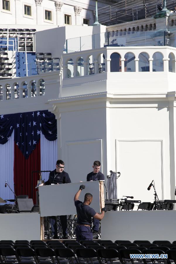 Workers put the finishing touch at the U.S. Capitol during preparations for U.S. President Barack Obama's second inauguration in Washington D.C., the United States, Jan. 20, 2013. An estimated 800,000 people may attend Monday's inauguration ceremony and parade. (Xinhua/Fang Zhe) 