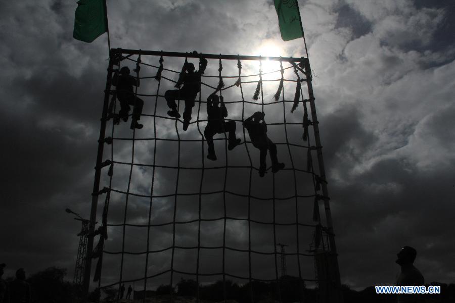 Palestinian students take part in a paramilitary training organized by Hamas National Security in the southern Gaza Strip city of Rafah on Jan. 23, 2013. (Xinhua/Khaled Omar) 