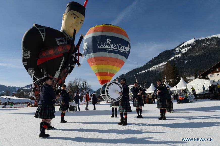 Cartoon balloons take off at the 35th International Ballon Festival in Chateau-d'Oex, Switzerland, Jan. 26, 2013. The 9-day ballon festival kicked off here on Saturday with the participation of over 80 balloons from 15 countries and regions. (Xinhua/Wang Siwei)