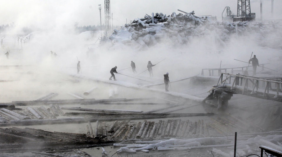 Some employees sort logs on a bank of the Yenisei River at the Novoyeniseisk wood processing plant, in the town of Lesosibirsk, some 300 kilometers north of the Siberian city of Krasnoyarsk on Jan. 31, 2013. The plant exports timber to Europe, Northern Africa and Asia. The taiga, also known as the boreal forest, on the coast of the Angara River is one of the main areas for the industrial cutting of wood thanks to the high quality of the Angara pine. Open air work continues all year around regardless to temperatures which can drop to minus 45 degrees Centigrade. (Xinhua News Agency/Reuters)