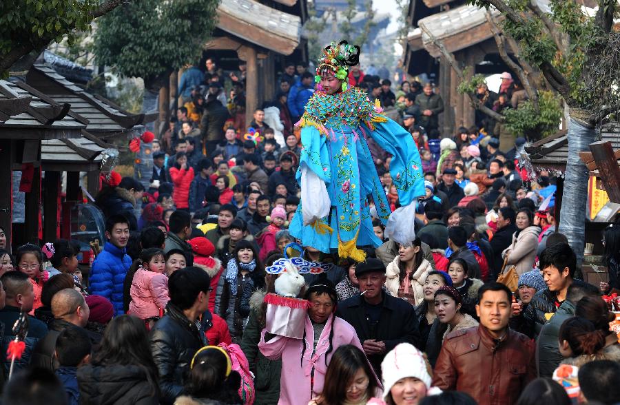 A little girl in Chinese ancient costume performs in a parade held to celebrate Chinese Lunar New Year, or Spring Festival, in Zaozhuang, east China's Shandong Province, Feb. 10, 2013. Various activities were held all over China on Sunday to celebrate the Spring Festival, marking the start of Chinese lunar Year of the snake. The Spring Festival falls on Feb. 10 this year. (Xinhua/Gao Qimin) 