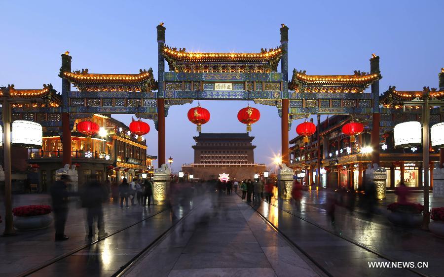 Photo taken on Feb. 15, 2013 shows the night scene of the Qianmen Street, a well-know commercial street, in downtown Beijing, capital of China. (Xinhua/Zhao Bing)  