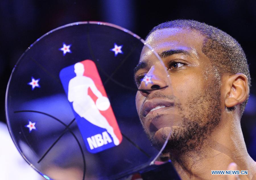 Chris Paul of the Los Angeles Clippers and the Western Conference celebrates after winning MVP in the 2013 NBA All-Star game at the Toyota Center on Feb. 17, 2013 in Houston, the United States, Feb. 17, 2013. (Xinhua/Zhang Jun) 