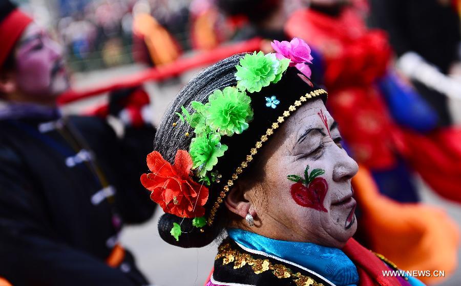 Performers take part in a Shehuo parade in Huangzhong County, northwest China's Qinghai province, Feb. 21, 2013. The performance of Shehuo can be traced back to ancient rituals to worship the earth, which they believe could bring good harvests and fortunes in return. Most Shehuo performances take place around traditional Chinese festivals, especially the Spring Festival and the Lantern Festival. (Xinhua/Zhang Hongxiang) 