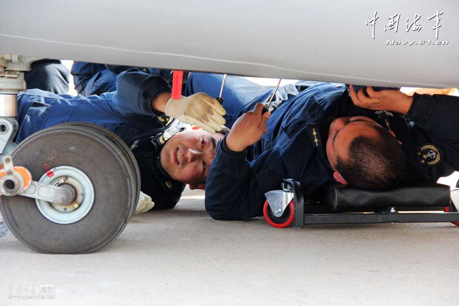 A carrier-based aircraft regiment under the Navy of the Chinese People's Liberation Army (PLA) conducts flight training after the Spring Festival on February 19, 2013. They not only completed the flight training subjects, but also made comprehensive maintenance and inspection to the airfield road, support vehicles, and the communication facilities. (navy.81.cn/Hu Baoliang, Zhang Wei, Zhang Yinjie)