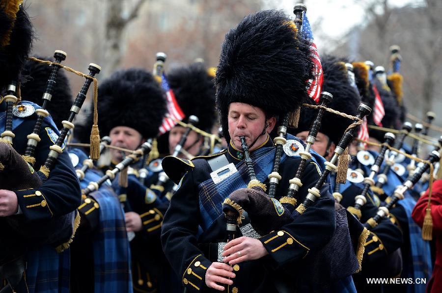 Port Authority Pipes and Drums band plays during the 20th anniversary ceremony to commemorate victims of the 1993 World Trade Center bombing attack, at Ground Zero in New York City on Feb. 26, 2013. The bomb explosion with the force of an earthquake rocked the building, killing 6 people and injuring more than 1,000. (Xinhua/Wang Lei) 