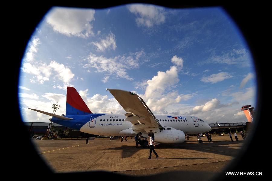 A Russian-made commercial plane Sukhoi Super Jet 100 (SSJ 100) lands at Halim Perdana Kusuma Airport in Jakarta, Indonesia, Feb. 28, 2013. An Indonesian airlines firm, Sky Aviation, received on Wednesday the initial delivery of SSJ 100, expecting five to join the fleet by the end of this year. (Xinhua/Agung Kuncahya B.)