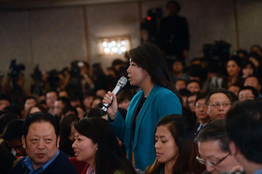 Gu Ruizhen, a journalist with Xinhua News Agency, asks a question at a news conference on the first session of the 12th Chinese People's Political Consultative Conference (CPPCC) National Committee held in Beijing, capital of China, March 2, 2013. The first session of the 12th CPPCC National Committee is scheduled to open in Beijing on March 3. (Xinhua/Jin Liangkuai)