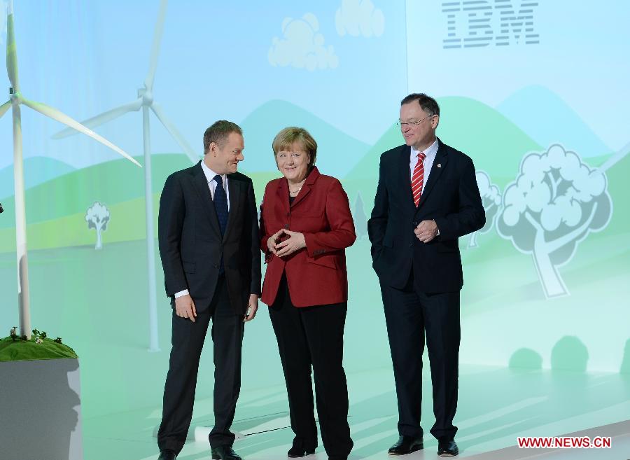 Polish Prime Minister Donald Tusk (L), German Chancellor Angela Merkel (C) and German Prime Minister of Lower Saxony Stephan Weil visit the showcase of IBM at the CeBIT tech fair in Hanover, Germany, March 5, 2013. CeBIT, the world's leading exhibition in the communication and information technology industry, opened Monday evening in Hanover, Germany. (Xinhua/Ma Ning) 