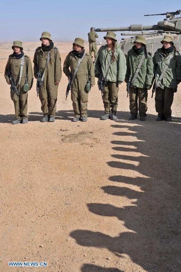 Female soldiers of Israel Defense Forces (IDF)'s Shiryon (tank corps) unit take part in a shooting training at Shizafon Armor Corps Training Base, south Israel, March 7, 2013 . These female soldiers will become instructors in Shiryon unit after finishing their 4-month training. (Xinhua/ Yin Dongxun) 