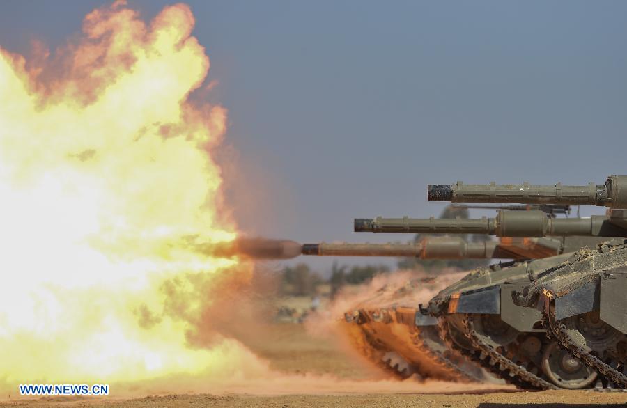 Female soldiers of Israel Defense Forces (IDF)'s Shiryon (tank corps) unit take part in a shooting training at Shizafon Armor Corps Training Base, south Israel, March 7, 2013 . These female soldiers will become instructors in Shiryon unit after finishing their 4-month training. (Xinhua/ Yin Dongxun) 