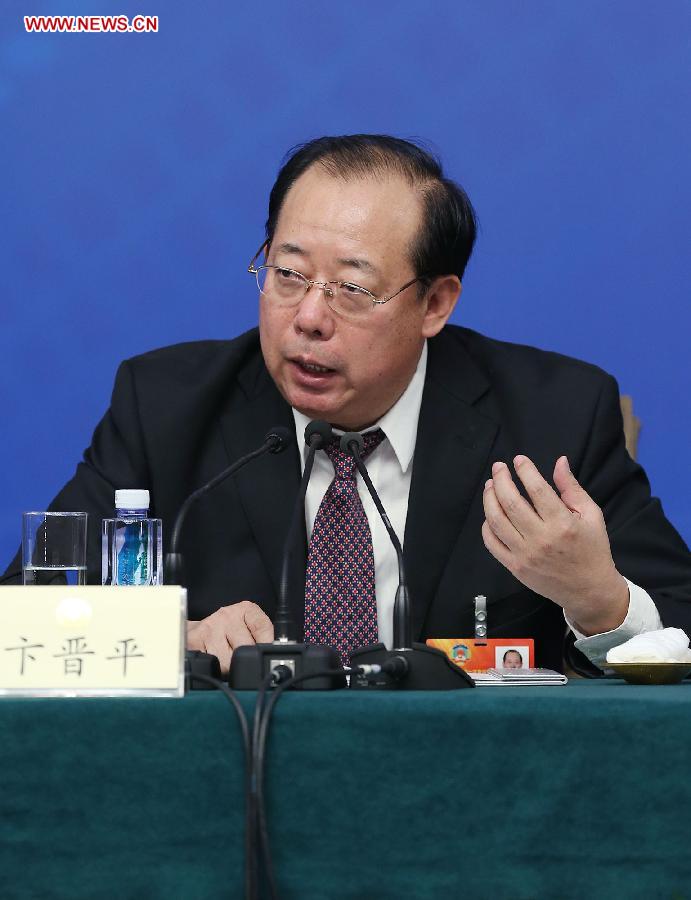 Bian Jinping, a member of the 12th National Committee of the Chinese People's Political Consultative Conference (CPPCC), speaks at a press conference held by the first session of the 12th CPPCC National Committee in Beijing, capital of China, March 8, 2013. Invited CPPCC members answered questions on improvements in political consultative system at the press conference. (Xinhua/Wang Shen)