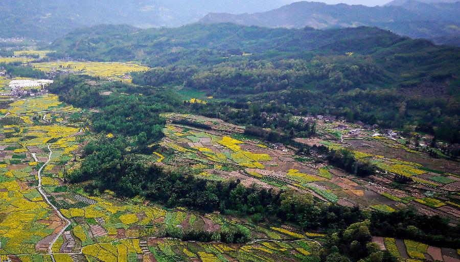 Photo taken on March 20, 2013 shows the aerial view of Siyan Township in Lushan County, southwest China's Sichuan Province. Located at where the Sichuan Basin and the Qinghai-Tibet Plateau meet, Lushan County boasts beautiful and diversified landscape. (Xinhua)