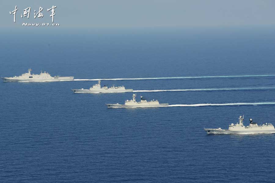 The picture shows the "Jinggangshan" amphibious dock landing ship, the "Lanzhou" guided missile destroyer, the "Yulin" guided missile frigate and the "Hengshui" guided missile frigate of the combat-readiness patrol and high-sea training taskforce under the South China Sea Fleet of the Navy of the Chinese People's Liberation Army (PLA) conducts training on the subject of battle-order deploying in the waters of the South China Sea on March 22, 2013. (PLA Daily/Qian Xiaohu Gao Yi and Gan Jun)