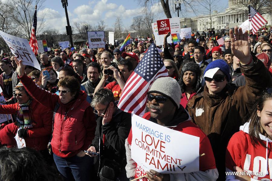 Supporters and opponents of same-sex marriage rally outside the U.S. Supreme Court in Washington D.C., capital of the United States, March 26, 2013. U.S. Supreme Court on Tuesday heard arguments of California's ban on same-sex marriage, opening two days of monumental proceedings on the issue. (Xinhua/Zhang Jun)