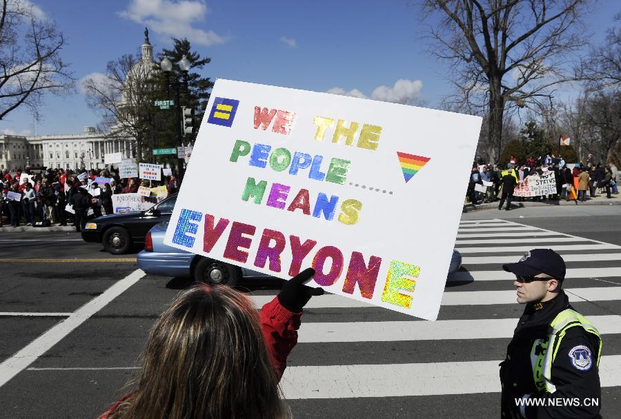 Supporters and opponents of same-sex marriage rally outside the U.S. Supreme Court in Washington D.C., capital of the United States, March 26, 2013. U.S. Supreme Court on Tuesday heard arguments of California's ban on same-sex marriage, opening two days of monumental proceedings on the issue. (Xinhua/Zhang Jun) 