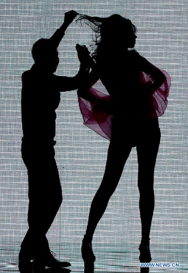 A model presents a creation during the MGPIN Collection at the China Fashion Week in Beijing, capital of China, March 27, 2013. (Xinhua/Chen Jianli) 