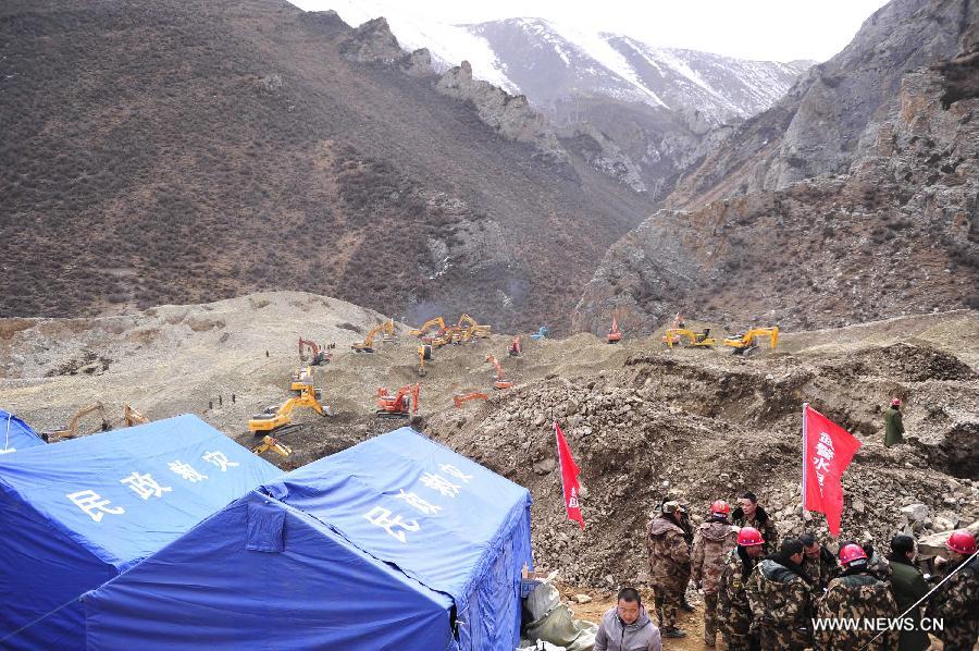 Rescuers work at the accident site in Maizhokunggar County of Lhasa, southwest China's Tibet Autonomous Region, March 31, 2013. Thirteen bodies have been found until 6:30 p.m. Sunday at the site of a mining area landslide. The disaster struck a workers' camp of the Jiama Copper Polymetallic Mine at about 6 a.m. on Friday, burying 83 workers. (Xinhua/Liu Kun)