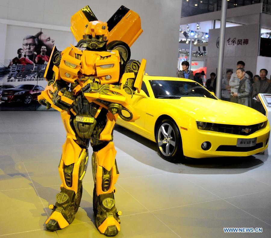 A bumblebee transformer stands by the exhibition area of Chevrolet during the 2013 Dahe Spring Auto Show in Zhengzhou, capital of central China's Henan Province, April 11, 2013. Over 70 domestic and overseas auto brands participated in the show. (Xinhua/Li Bo)