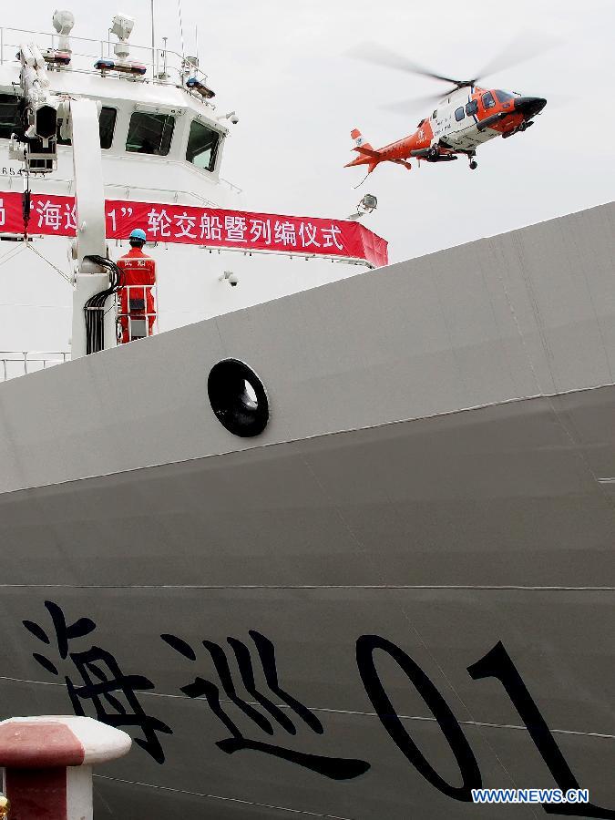 A rescue helicopter of patrol vessel Haixun 01 flies over the Huangpu River in Shanghai, east China, April 16, 2013. Haixun 01, officially delivered and put into service Tuesday and managed by the Shanghai Maritime Bureau, is China's largest and most advanced patrol vessel. The 5,418-tonnage Haixun01 is 128.6 meters in length and has a maximum sailing distance of 10,000 nautical miles (18,520 km) without refueling. It will carry out missions regarding maritime inspection, safety monitoring, rescue and oil spill detection and handling. (Xinhua/Chen Fei) 