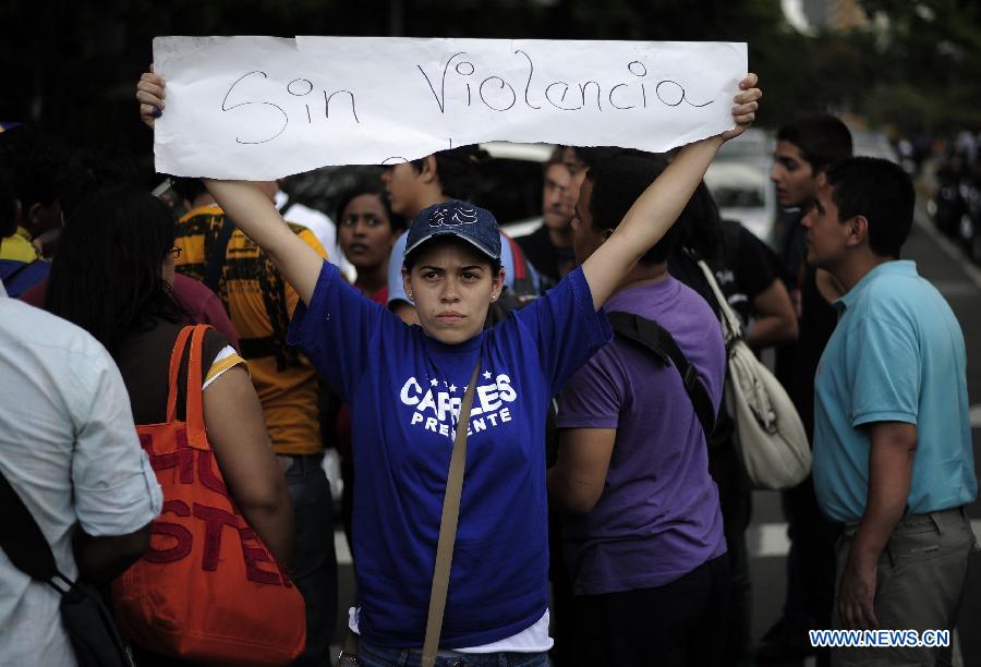 Supporters of opposition leader Henrique Capriles participate in a protest in Caracas, capital of Venezuela, on April 16, 2013. Venezuela's elected President Nicolas Maduro said that he would not allow the opposition to go ahead with a planned protest march on Wednesday through the streets of Caracas. (Xinhua/Mauricio Valenzuela) 