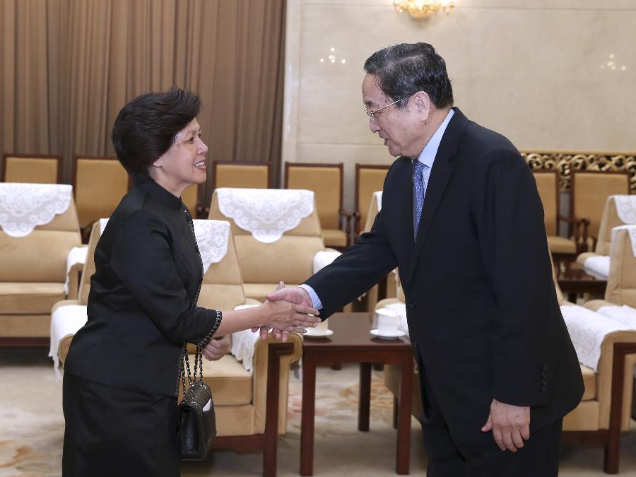 Yu Zhengsheng (R), chairman of the National Committee of the Chinese People's Political Consultative Conference, meets with Norodom Arun Rasmey, president of Cambodian royalist party Funcinpec, in Beijing, capital of China, April 17, 2013. (Xinhua/Pang Xinglei) 