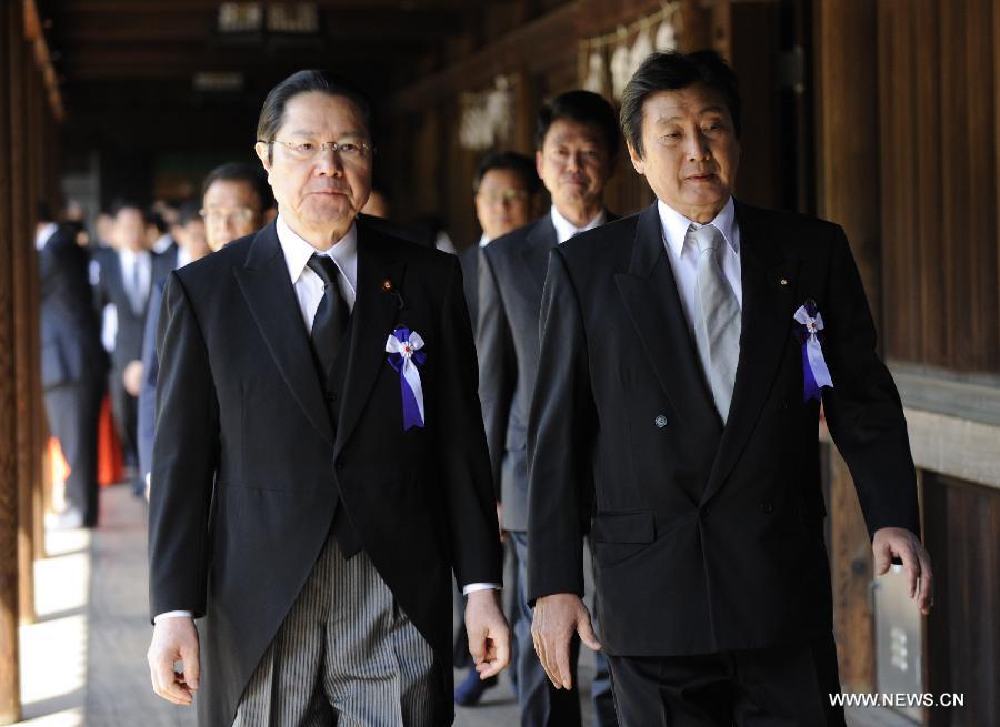 Japanese lawmakers are ready to leave after visiting the Yasukuni Shrine in Tokyo, Japan, on April 23, 2013. Despite repeated strong opposition from China, a group of 168 Japanese lawmakers on Tuesday visited the controversial war-link Yasukuni Shrine in Tokyo, which honors Japanese war criminals of World War II. It marked the first time that the Japanese lawmakers' number exceeded 100 since October 2005, according to local media. (Xinhua) 