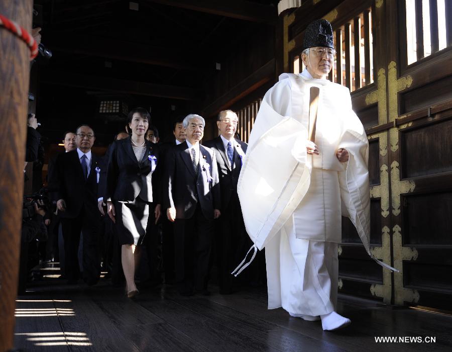 Japanese lawmakers head to visit the Yasukuni Shrine in Tokyo, Japan, on April 23, 2013. Despite repeated strong opposition from China, a group of 168 Japanese lawmakers on Tuesday visited the controversial war-link Yasukuni Shrine in Tokyo, which honors Japanese war criminals of World War II. It marked the first time that the Japanese lawmakers' number exceeded 100 since October 2005, according to local media. (Xinhua) 