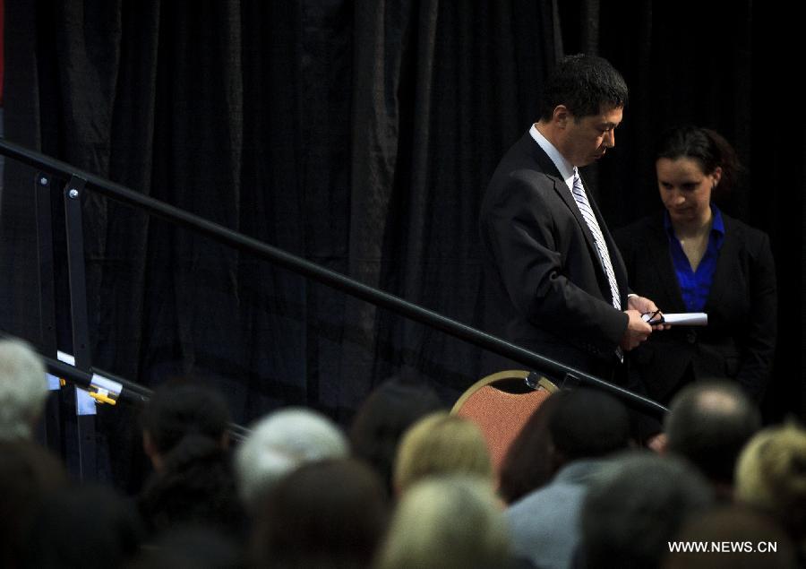 Lu Jun, father of Boston bombing victim Lu Lingzi, steps off the platform after reading the eulogy of his daughter during her memorial service at Boston University in Boston, the United States, on April 22, 2013. Lu Lingzi, a Boston University student from China, was killed in the deadly Boston Marathon explosions on April 15. (Xinhua/Pool/Boston Globle)